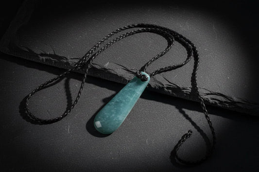Highly translucent Guatemalan Princessa jadeite pendant showing natural snow phenomenon